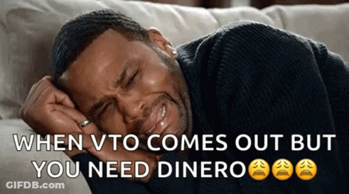 A Man Is Crying While Laying On A Couch With The Words When Vto Comes Out But You Need Dinero GIF
