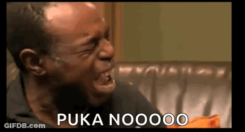 A Man Is Crying While Sitting On A Couch And Saying Puka Noooo . GIF