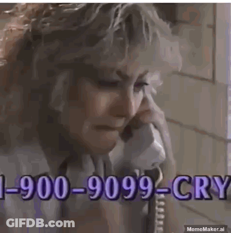 A Man Is Crying While Talking On A Phone With A Phone Number . GIF