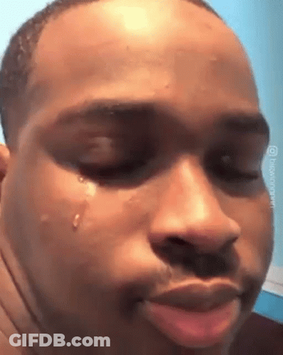 A Man Is Crying With A Tear Coming Out Of His Eye . GIF