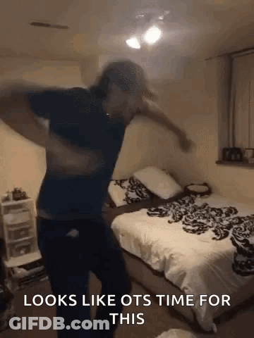A Man Is Dancing In A Bedroom With The Words `` Looks Like Ots Time For This '' . GIF