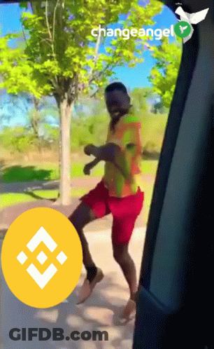 A Man Is Dancing In A Car With A Changeangel Logo Behind Him GIF