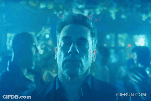 A Man Is Dancing In A Club With A Gif Run.com Watermark GIF