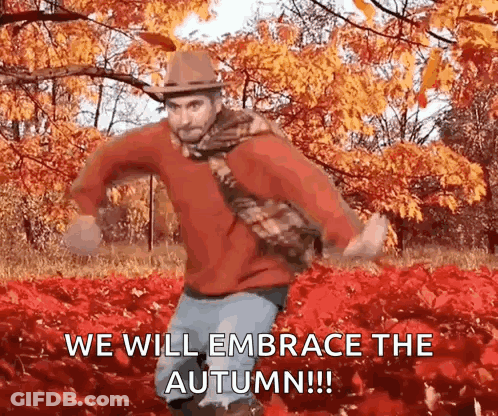 A Man Is Dancing In A Field Of Leaves With The Words `` We Will Embrace The Autumn ! '' GIF