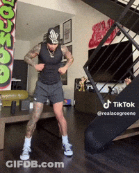 Man Dancing In Living Room With TikTok Sign GIF