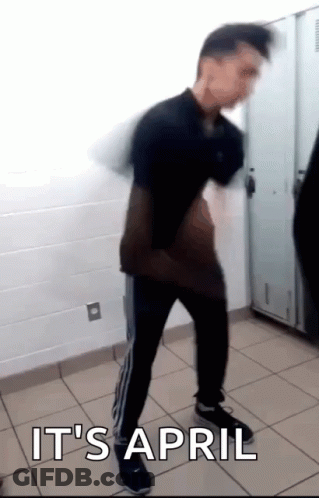 A Man Is Dancing In A Locker Room With The Words It 'S April Written On The Floor GIF
