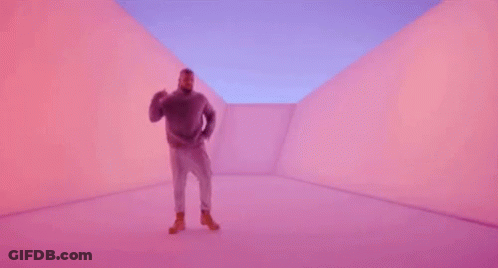 A Man Is Dancing In A Purple Room . GIF