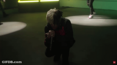 A Man Is Dancing In A Room With A Jbl Logo On The Bottom Right GIF