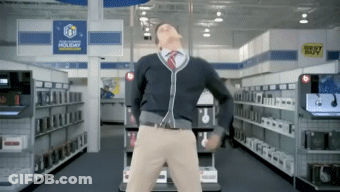 A Man Is Dancing In A Store With A Best Buy Sign In The Background GIF