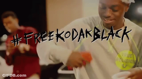 A Man Is Dancing In A Video That Says #Free Kodak Black GIF