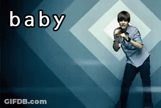 A Man Is Dancing In Front Of A Baby Sign GIF