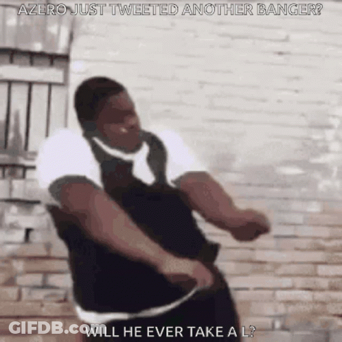 A Man Is Dancing In Front Of A Brick Wall With The Words `` Will He Ever Take A L '' . GIF