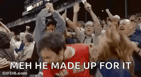 A Man Is Dancing In Front Of A Crowd Of People With The Words `` Meh He Made Up For It '' Written On The Bottom . GIF