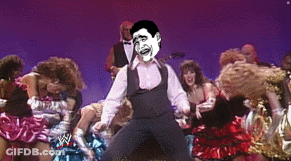 A Man Is Dancing In Front Of A Crowd With A Wrestling Logo On The Bottom GIF