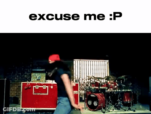 A Man Is Dancing In Front Of A Drum Set With The Words Excuse Me : P On The Bottom GIF