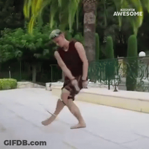 A Man Is Dancing In Front Of A Fence With The Words Awesome On The Bottom Right GIF