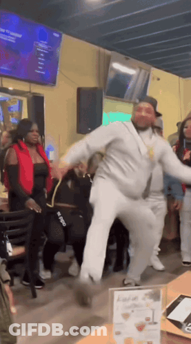 Man Dancing In Front Of Group GIF