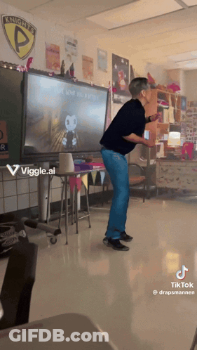 A Man Is Dancing In Front Of A Screen That Says Knight 'S P GIF