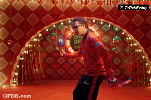 A Man Is Dancing In Front Of A Sign That Says Chaw Dh GIF