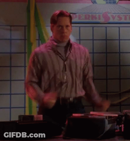 A Man Is Dancing In Front Of A Sign That Says Perki Vs GIF