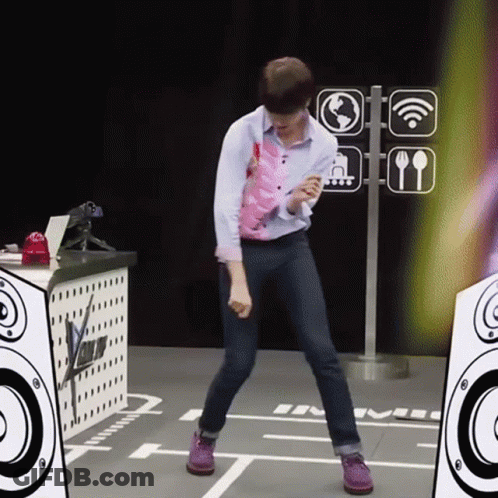 A Man Is Dancing In Front Of A Sign That Says ' Wifi ' On It GIF