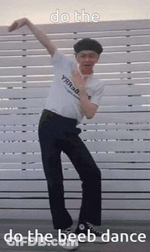 Man Doing Beeb Dance In Front Of Fence GIF