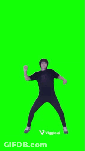 A Man Is Dancing On A Green Screen With His Hands In The Air . GIF