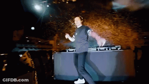 A Man Is Dancing On A Stage In Front Of A Mixer GIF