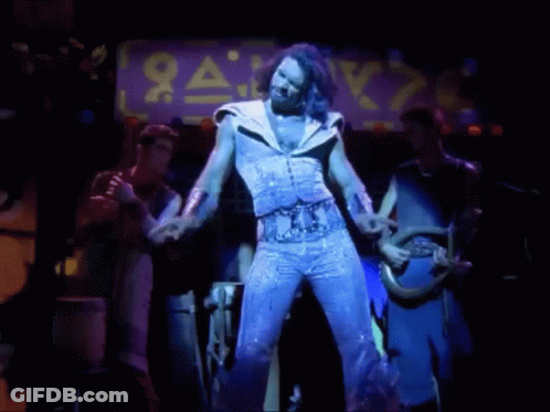 Man Dancing On Stage With Sale Sign GIF