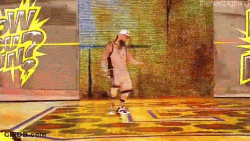 A Man Is Dancing On A Stage In Front Of A Sign That Says The Next Thing . GIF