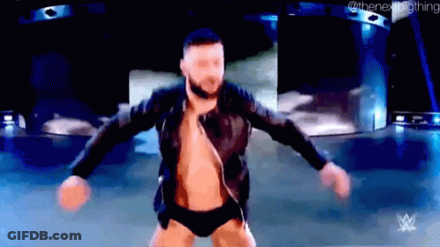 A Man Is Dancing On A Stage With His Arms Outstretched . GIF