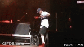 A Man Is Dancing On A Stage With Makeagif.com Written On The Bottom Of The Screen GIF