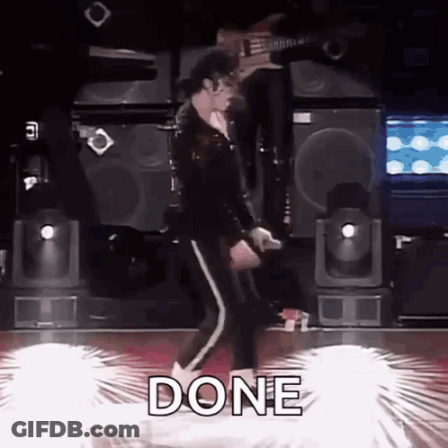 A Man Is Dancing On A Stage With The Word Done Written On The Floor In Front Of Him . GIF