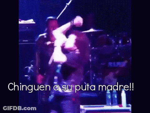 A Man Is Dancing On A Stage With The Words " Chinguen A Su Puta Madre " In The Corner GIF