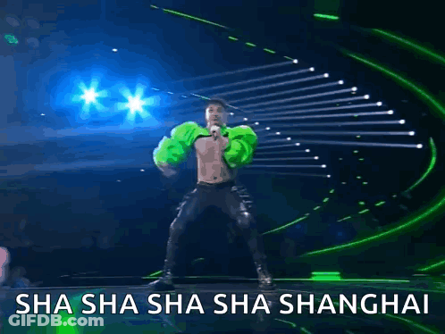 A Man Is Dancing On A Stage With The Words Sha Sha Sha Sha Shanghai GIF