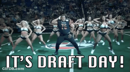 A Man Is Dancing With Cheerleaders On A Football Field With The Words It 'S Draft Day ! GIF