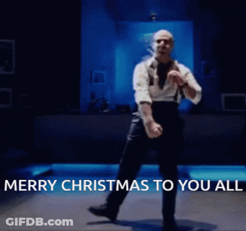 A Man Is Dancing With The Words Merry Christmas To You All Written Below Him GIF