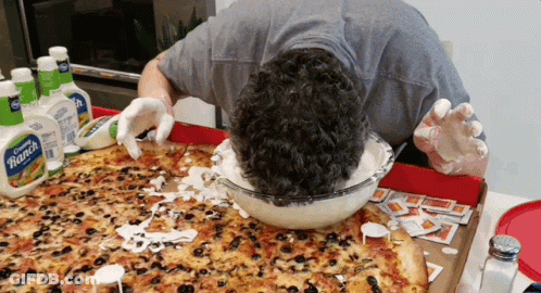 A Man Is Dipping His Head In Ranch Dressing GIF