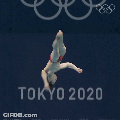 A Man Is Diving Into A Pool In Front Of A Tokyo 20 Sign GIF
