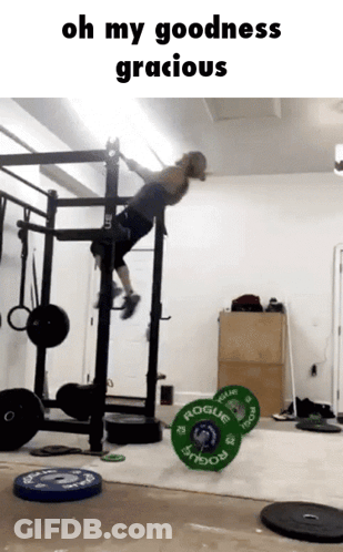 A Man Is Doing A Pull Up In A Gym With The Words Oh My Goodness Gracious On The Bottom GIF