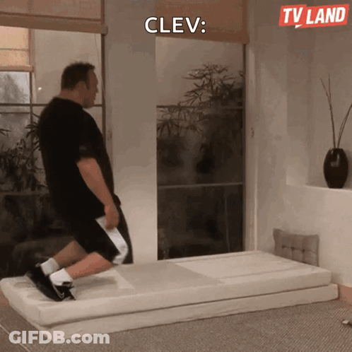 A Man Is Doing Exercises On A Mattress With A Tv Land Logo In The Background GIF