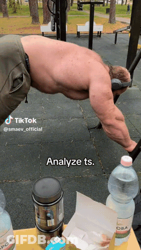 A Man Is Doing Push Ups In A Park With A Caption That Says Analyze Ts. GIF
