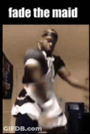 A Man Is Dressed As A Maid And Dancing . GIF