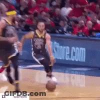 A Man Is Dribbling A Basketball On A Basketball Court In Front Of A Store.com Sign . GIF