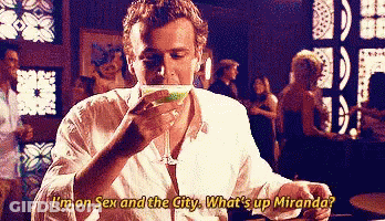 A Man Is Drinking A Martini And Saying I 'M On Sex And The City What 'S Up Miranda . GIF