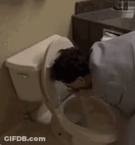 A Man Is Drinking Out Of A Toilet . GIF