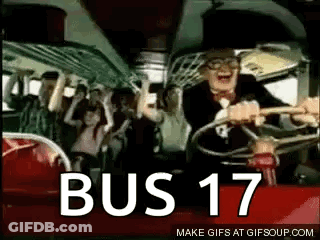 A Man Is Driving A Bus With A Crowd Of People On It And The Words Bus 17 On The Bottom . GIF