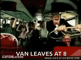A Man Is Driving A Bus With A Crowd Of People On The Back . GIF