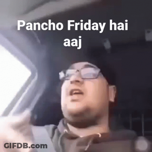 A Man Is Driving A Car And Making A Funny Face . GIF