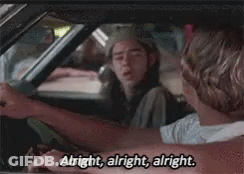 A Man Is Driving A Car And Says `` Alright , Alright , Alright '' . GIF